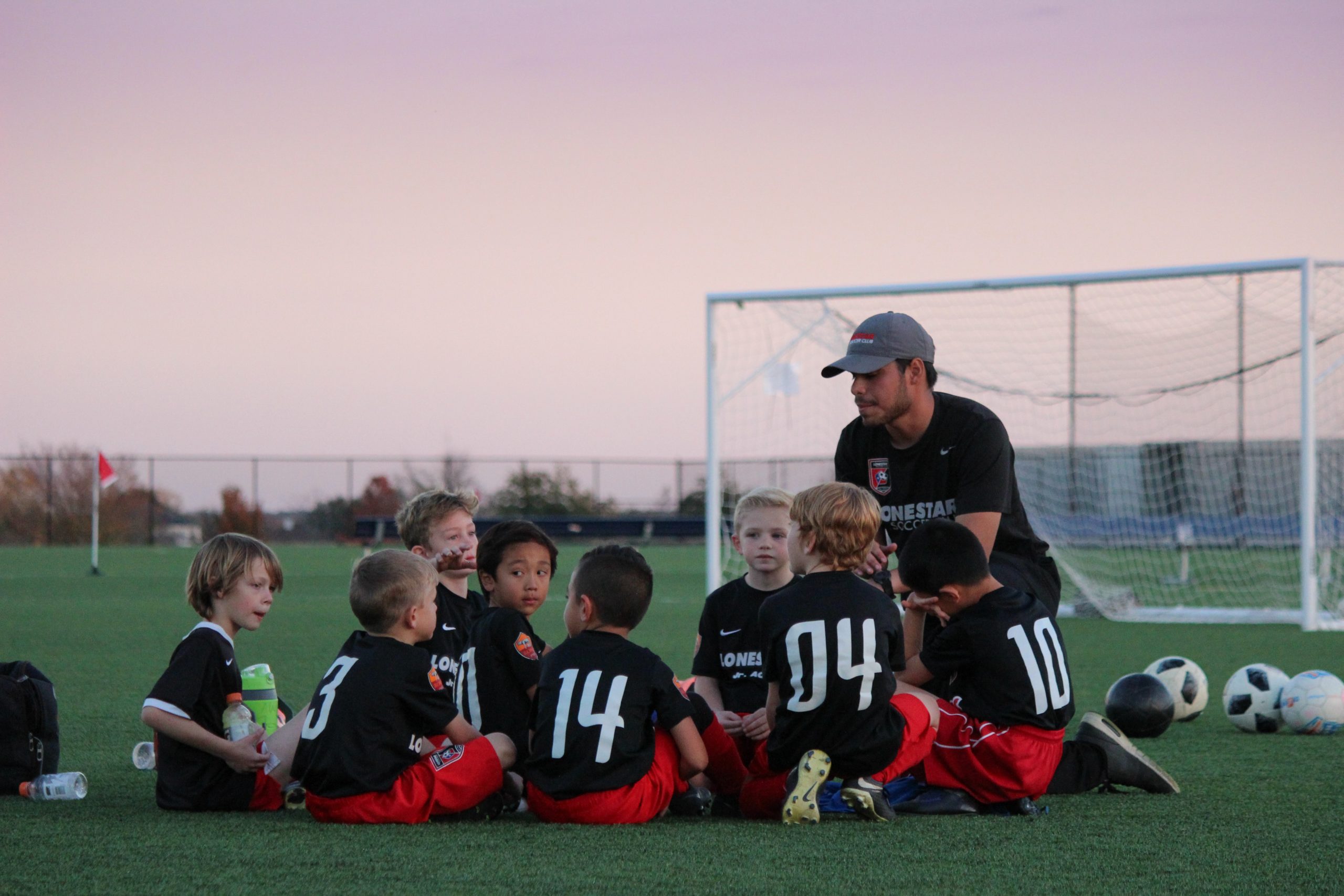 group of boys sitting on ground