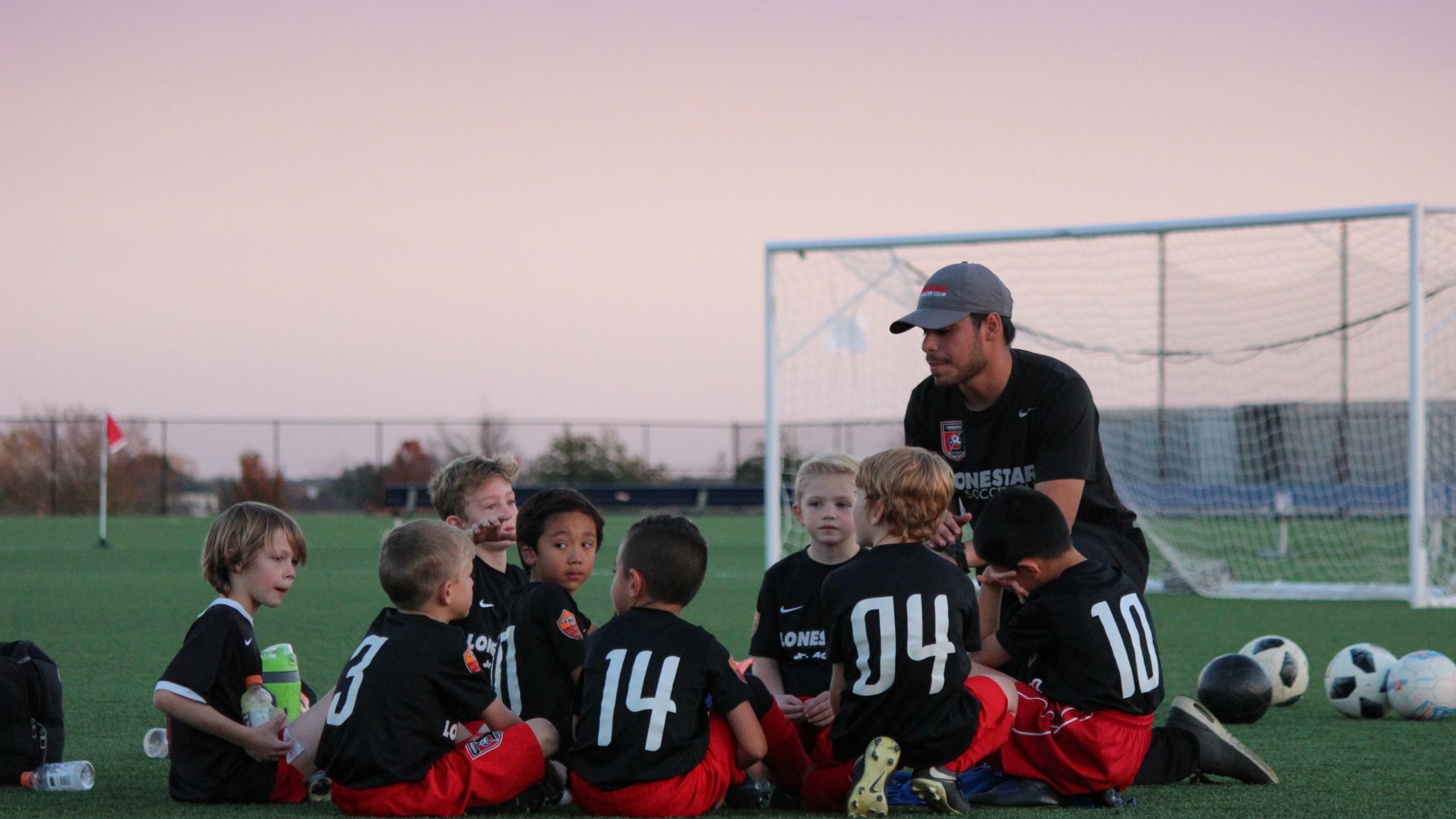 group of boys sitting on ground