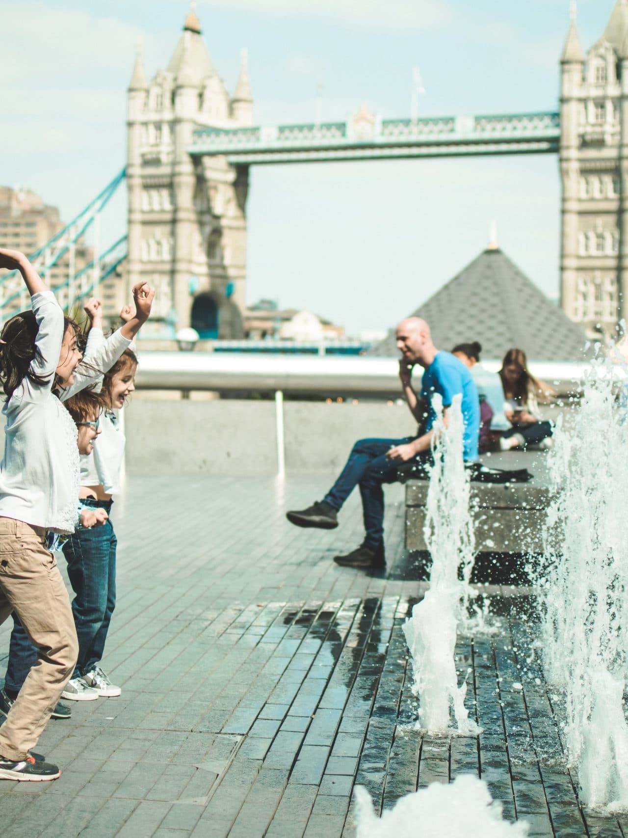 children playing near fountain