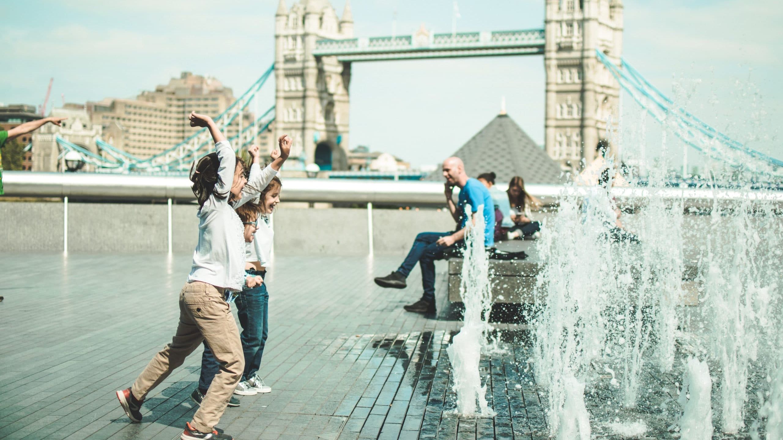 children playing near fountain