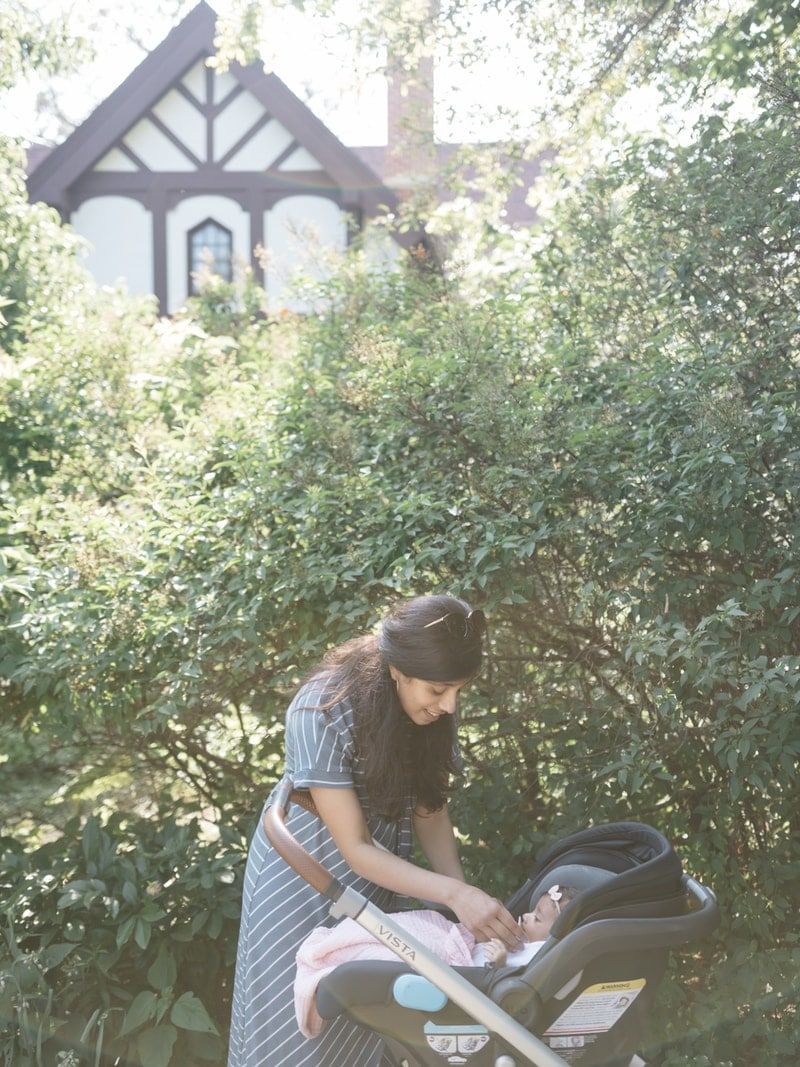 woman standing near stroller