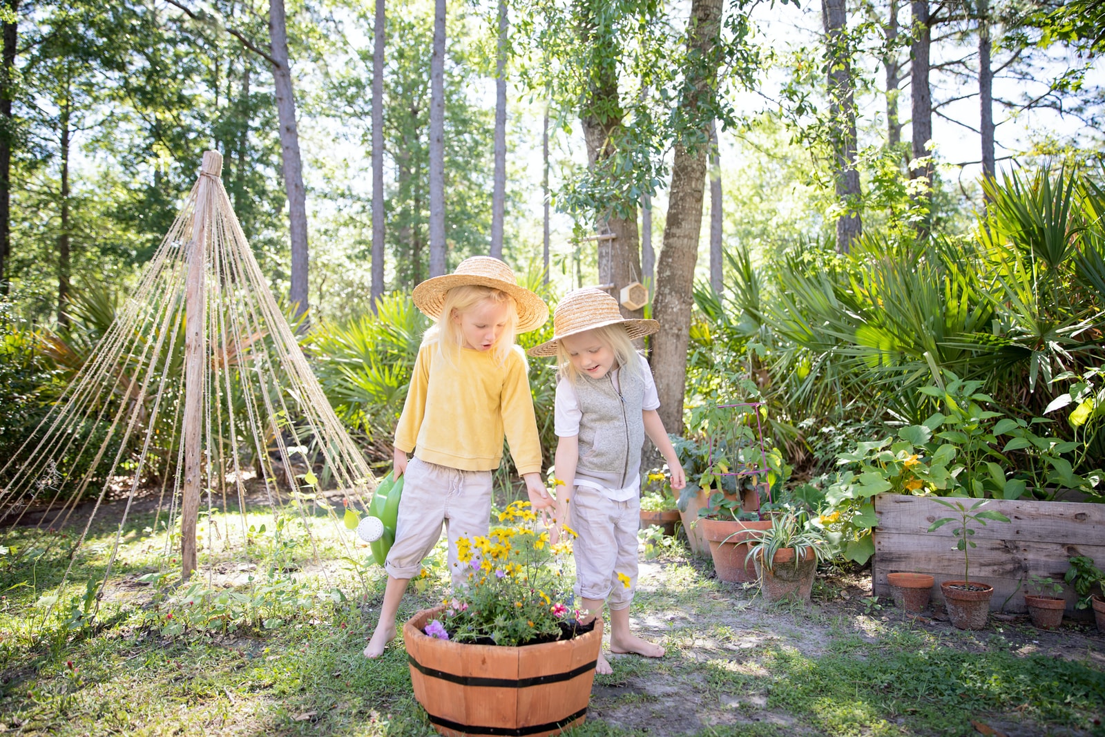 woman in yellow hijab and gray pants holding brown wooden basket