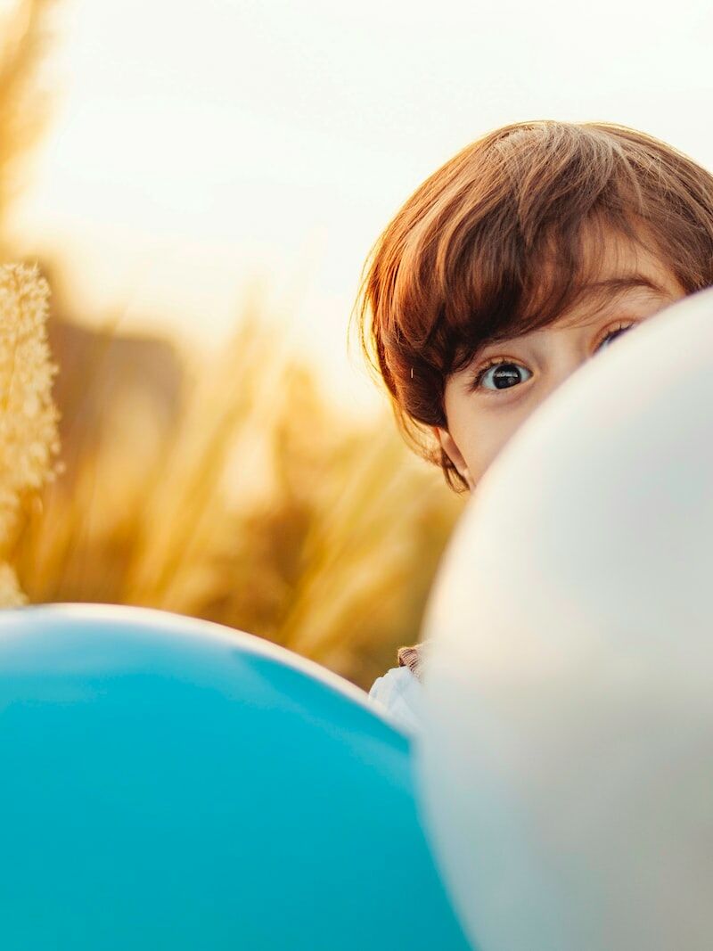 woman hiding on balloon